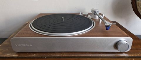 Victrola Stream Sapphire turntable on a wooden table