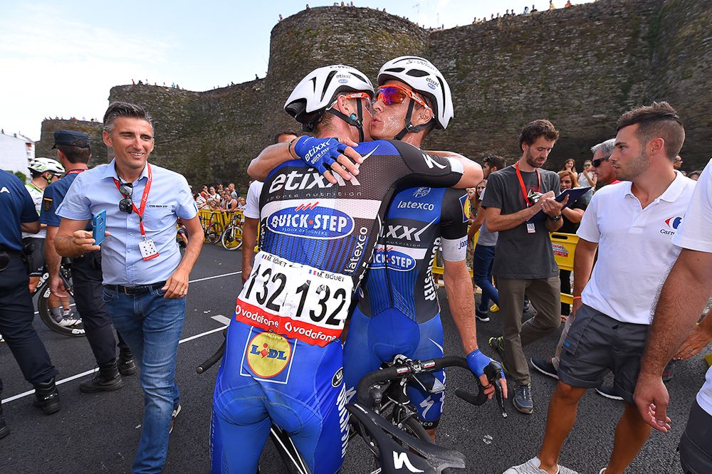 Gianni Meersman and a teammate celebrate winning stage 5 at the Vuelta a Espana.