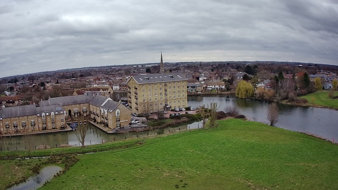 Ruko F11GIM2 Drone Example Image - aerial view of town's riverside.