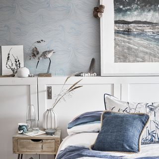 bedroom with blue wall and white cabinets