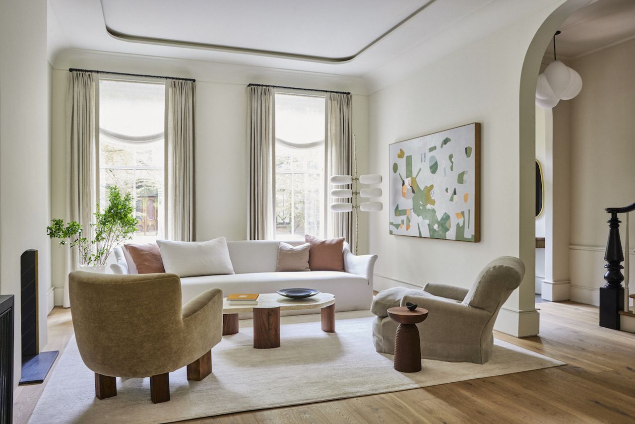 A living room with light colored walls