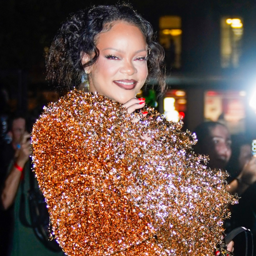 Rihanna attends Mati&egrave;res F&eacute;cales's Spring/Summer 2027 show at Paris Fashion Week, wearing a glittery orange matching set and a peekaboo bra