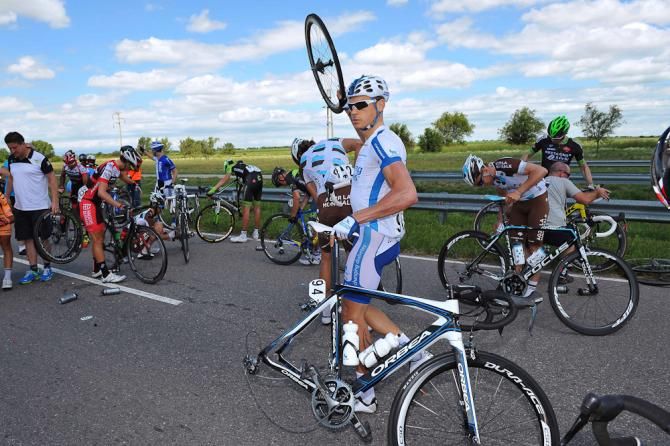 Riders wait for service following a late crash.