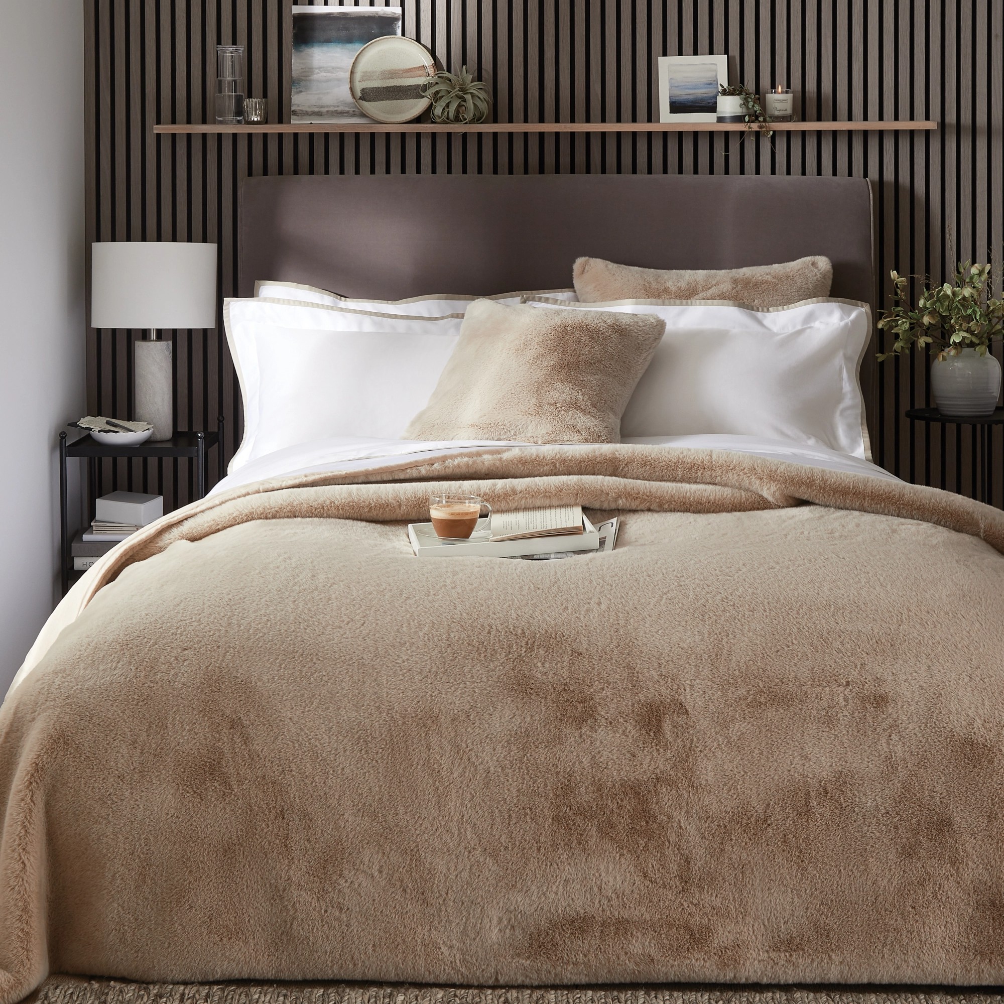 The White Company&#039;s Super Soft Faux Fur Cushions and throw on a bed