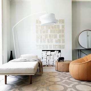 bedroom with floor lamp and bed with pillows
