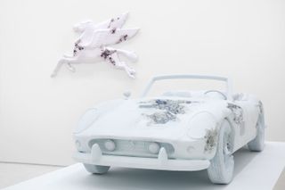car sculptures featuring a white Ferrari