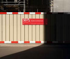 Redesign of RIBA logo with bold upper case serif font in red over white background