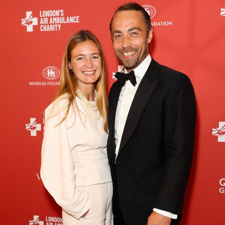 James Middleton and Alizee Thevenet posing on a red carpet