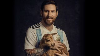 Lionel Messi posing with a goat