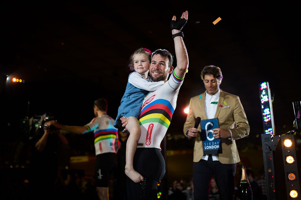 Mark Cavendish of Great Britain celebrates on the podium with his daughter Delilah Grace Cavendish during the Six Day London