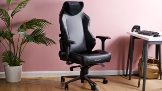 DXRacer Craft with plant, desk, and pink wall in background