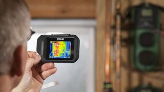 Man using one of the best thermal-imaging cameras