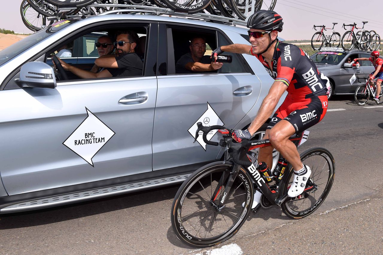 Philippe Gilbert collects some water from the BMC car