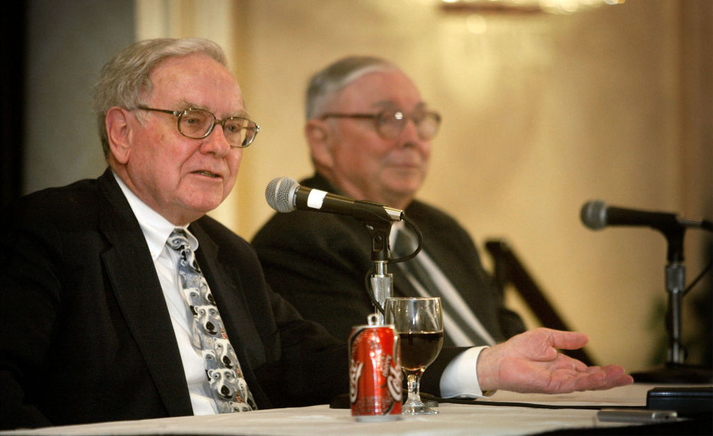 Warren Buffett (L) and his business partner Charles Munger answer questions at a news conference May 4, 2003 in Omaha, Nebraska.
