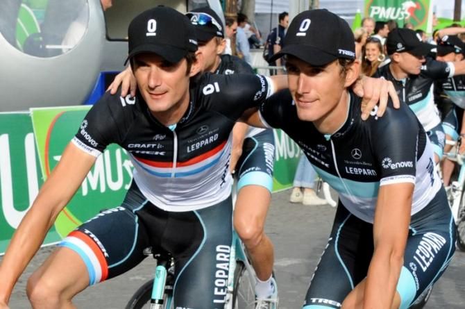 Andy and Frank Schleck celebrate after the 2011 Tour de France