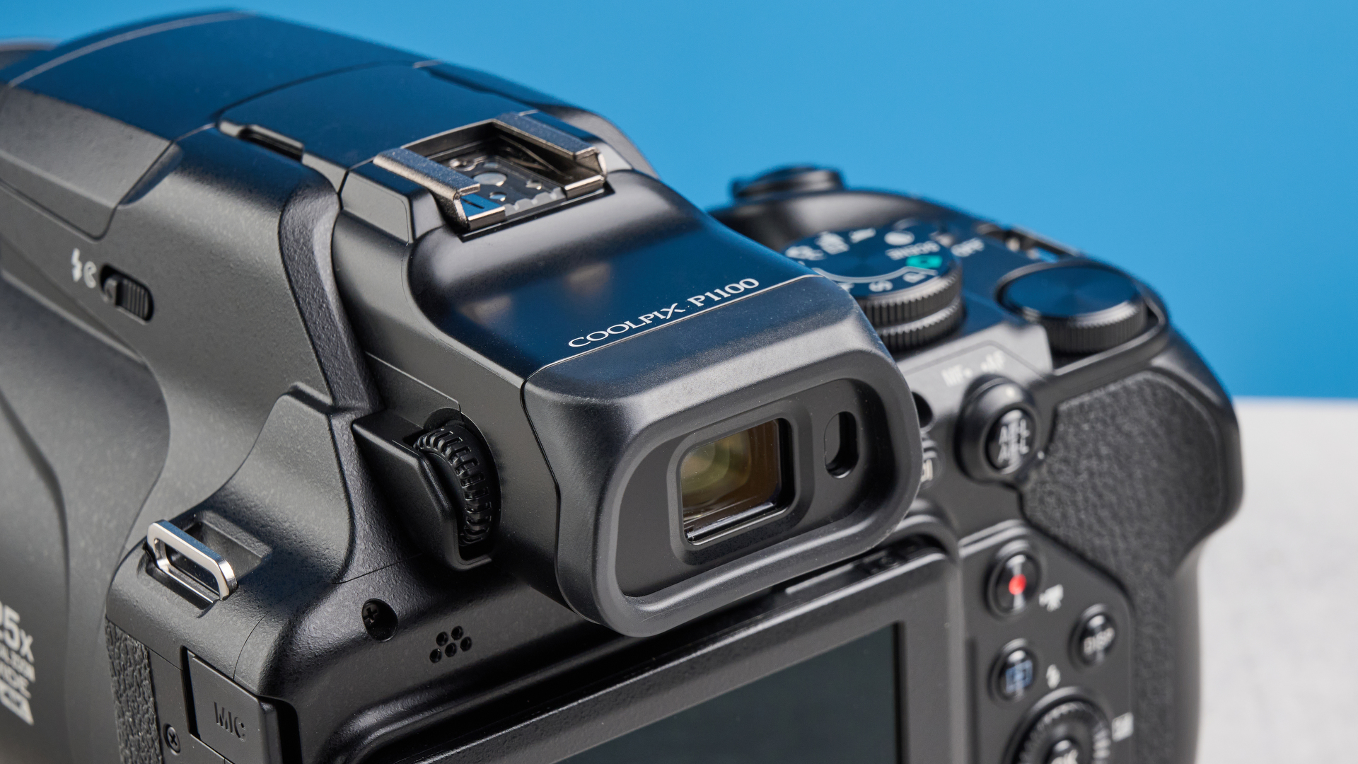 A black Nikon Coolpix P1100 digital camera