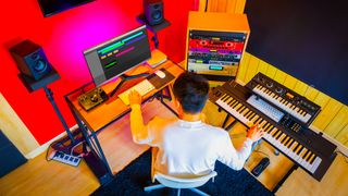 Overhead shot of man in studio recording keyboards