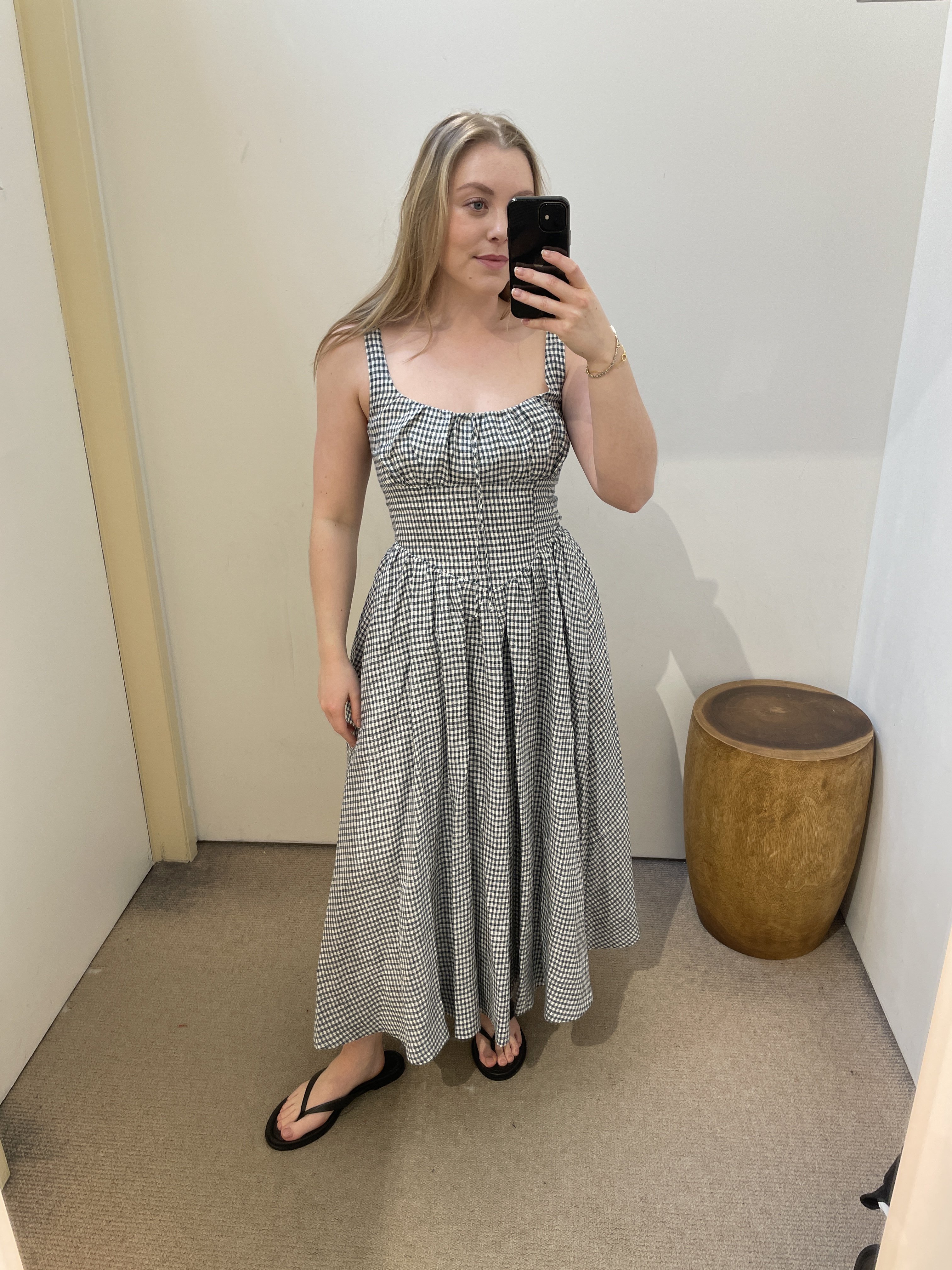 Florrie wears a gingham printed dress