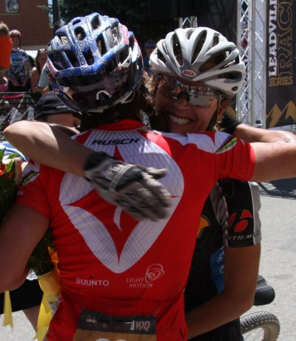 Rebecca Rusch and Gretchen Reeves exchange hugs after finishing Leadville