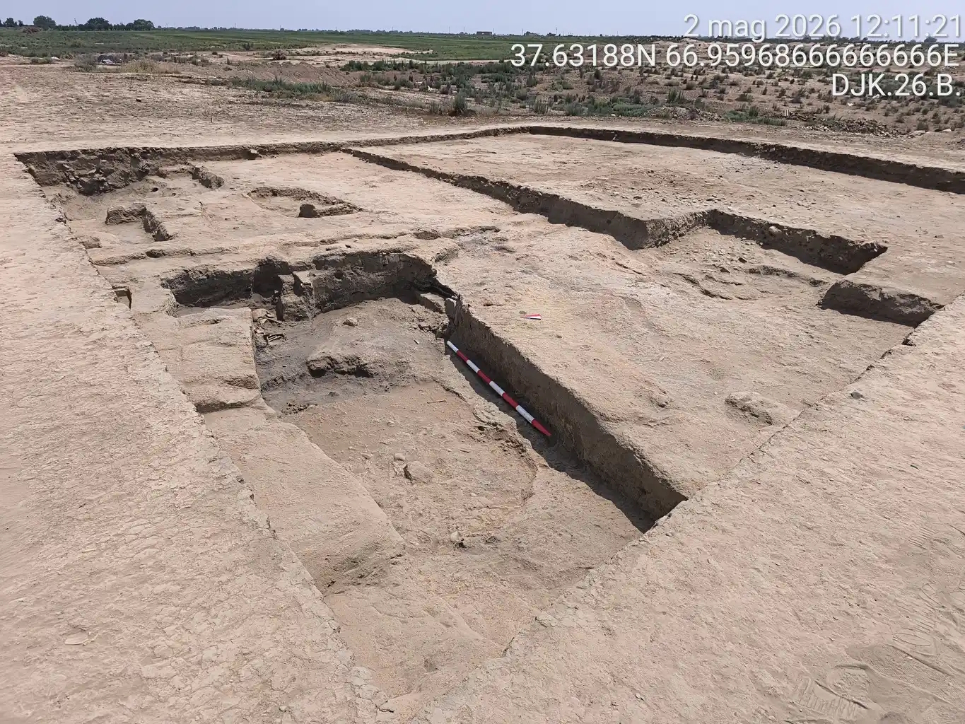 A close up of several open burial pits carved in stone.