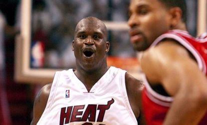 Shaquille O'Neal celebrates after a dunk while playing for the Miami heat: Commentators reflect on the retiring athlete's huge career and personality.