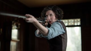 Caitriona Balfe as armed Claire Fraser in Outlander