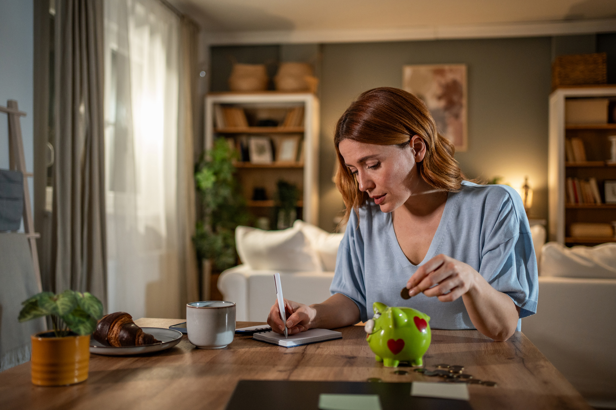 Woman managing home finances and savings
