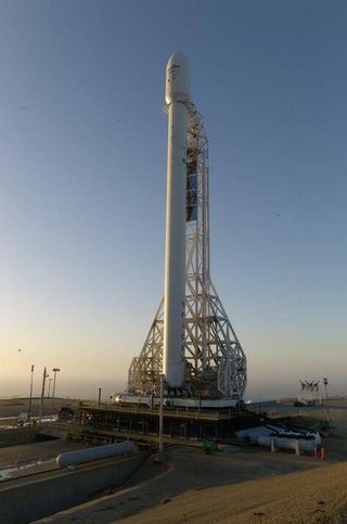An upgraded SpaceX Falcon 9 rocket stands poised to launch from Space Launch Complex 4 at Vandenberg Air Force Base in California in September 2013. Liftoff set for Sept. 29, 2013.