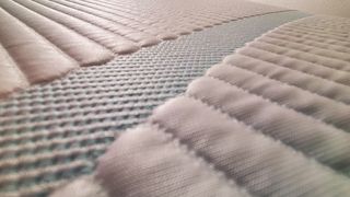 Tempur-Adapt mattress review featuring a close-up of the knit cover
