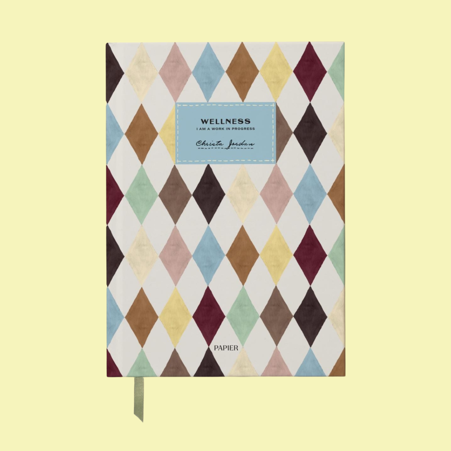 A harlequin-themed journal