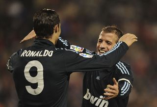 VALLADOLID, SPAIN - MARCH 14: Cristiano Ronaldo (L) of Real Madrid celebrates with Rafael Van Der Vaart after Real scored their 4th goal during the La Liga match between Valladolid and Real Madrid at Estadio Jose Zorilla on March 14, 2010 in Valladolid, Spain. (Photo by Denis Doyle/Getty Images)