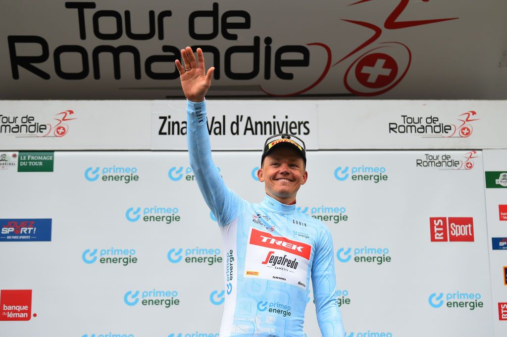 ZINAL VAL DANNIVIERS SWITZERLAND APRIL 30 Toms Skujins of Latvia and Team Trek Segafredo celebrates at podium as Blue Mountain Jersey winner during the 75th Tour De Romandie 2022 Stage 4 a 1801km stage from Aigle to Zinal Val dAnniviers 1664m TDR2022 on April 30 2022 in Zinal Val dAnniviers Switzerland Photo by Dario BelingheriGetty Images