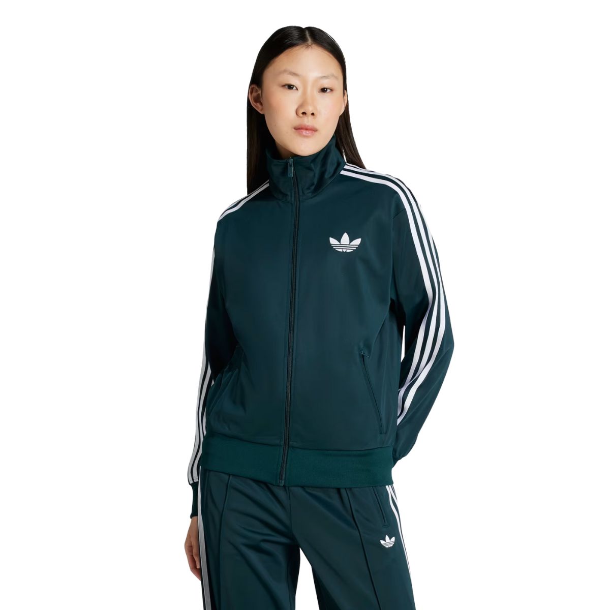 woman wearing a dark green adidas tracksuit