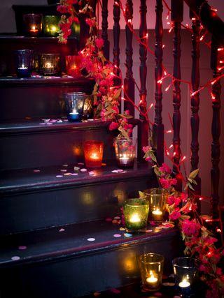 Candles and stringlights going up stairs