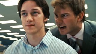 James McAvoy sits smiling while Chris Pratt looms over his shoulder in Wanted.