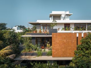 The exterior of Bengaluru House of Greens showing several layers of the build
