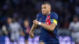 Kylian Mbappe of PSG running during a match