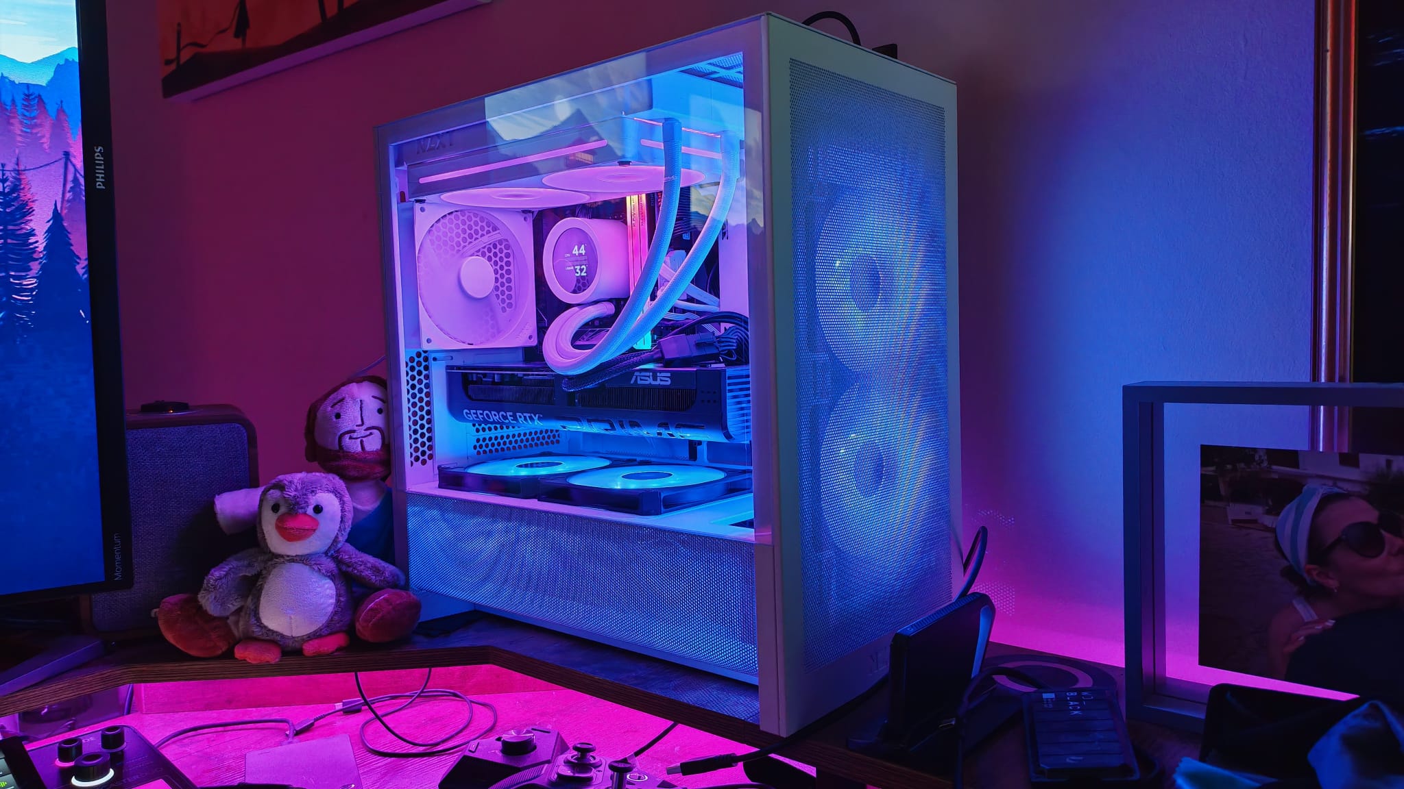 A white gaming PC with negative pressure in RGB lighting