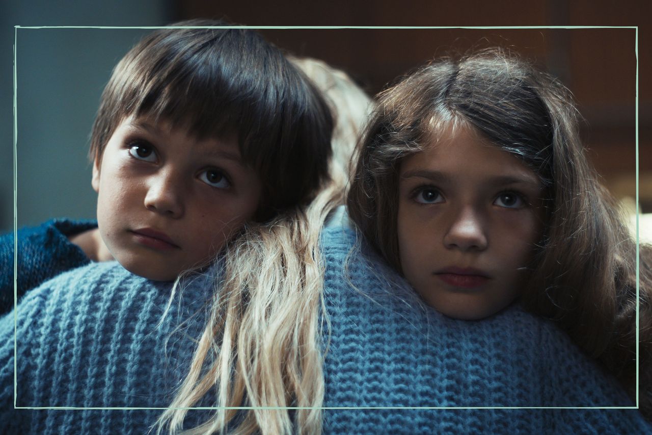 A girl and a boy being hugged by a blonde woman in Dear Child