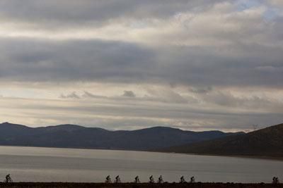 Riders cross the Brandvlei Dam wall during stage six