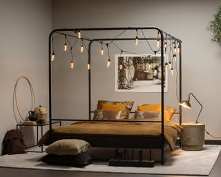 Kingsize Black Metal Four Poster Bed with Black Edison-Style Festoon String Lighting