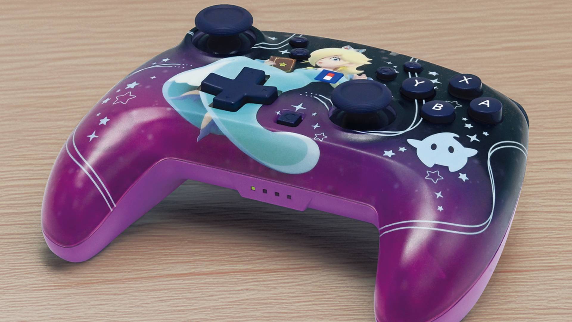Image of the Hori Princess Rosalina Switch 2 controller on a wooden table.