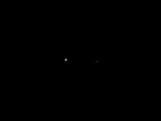 Earth (on the left) and the moon (on the right) were seen by NASA's Juno spacecraft on Aug. 26, 2011, when the spacecraft was about 6 million miles (9.66 million kilometers) away. The photo was taken by the spacecraft's onboard camera, JunoCam.