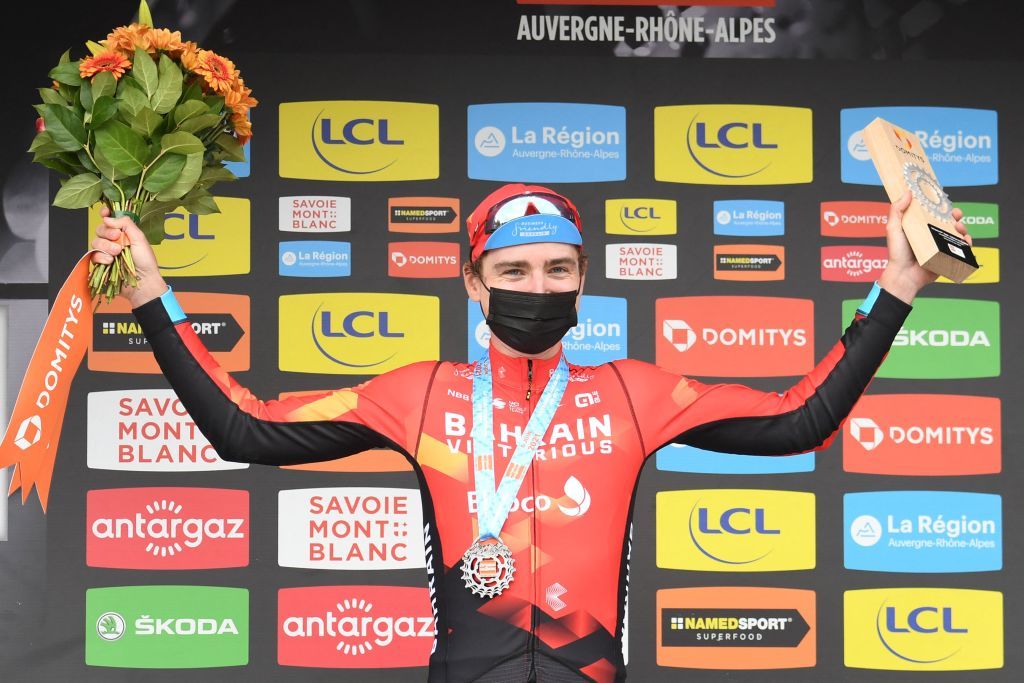 Stage winner Team Bahrains Mark Padun of Ukraine celebrates on the podium after winning the eighth stage of the 73rd edition of the Criterium du Dauphine cycling race a 147km between La LechereLesBains and Les Gets on June 6 2021 Photo by Alain JOCARD AFP Photo by ALAIN JOCARDAFP via Getty Images