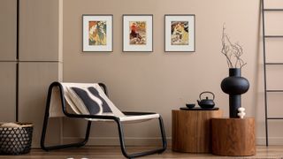 Three PocketBook InkPoster e-ink digital picture frames are displayed on a wall