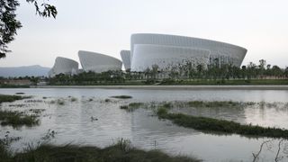The complex is composed of five main buildings, spread along the river bank.