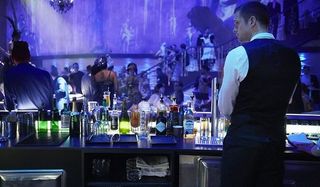 Mute Alexander Skarsgard Leo tends to the bar while looking to the side