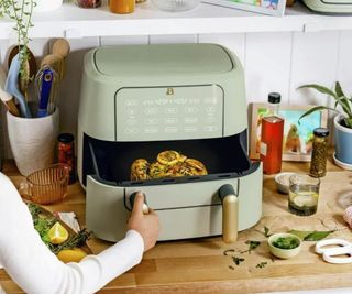Beautiful by Drew Barrymore air fryer on a kitchen counter.