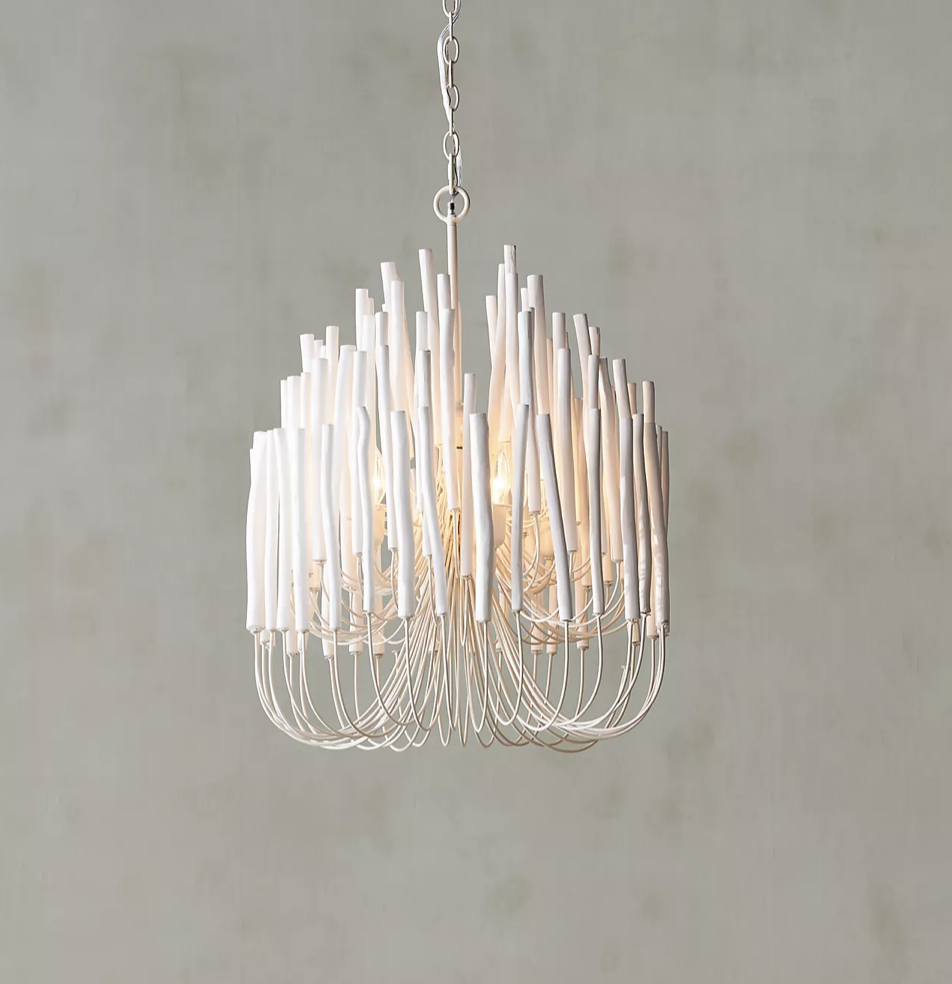 Statement chandelier comprised of concentric agar wood candles.