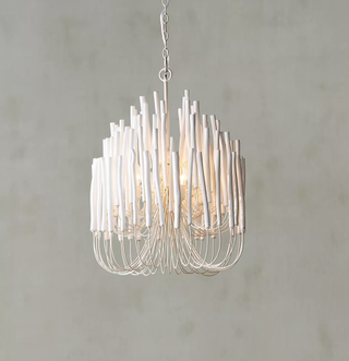 Statement chandelier comprised of concentric agar wood candles. 